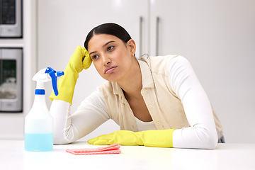 Image showing Woman, cleaner is tired and sad or bored, unhappy with housework and housekeeping with chemical detergent spray. Spring cleaning, exhausted with female person in kitchen and housekeeper with burnout