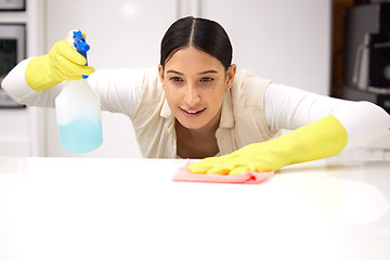 Image showing Woman, clean table with chemical detergent spray and cloth with focus and wipe dirt. Housekeeping, female cleaner concentrate at home with hygiene, cleaning with bottle and disinfecting surface