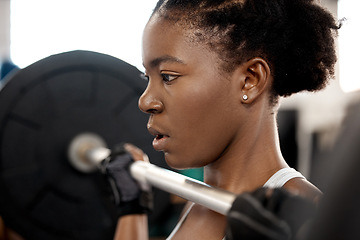 Image showing Face, weightlifting and barbell with black woman in gym for workout, strong and muscle. Health, challenge and exercise with female bodybuilder and weights for focus, performance and commitment