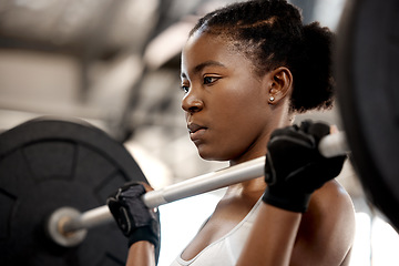Image showing Focus, weightlifting and barbell with black woman in gym for workout, strong and muscle. Health, challenge and exercise with female bodybuilder and weights for fitness, performance and commitment