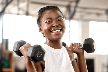 Image showing Weightlifting, dumbbell and portrait with black woman in gym for workout, strong and muscle. Exercise, weights and sports equipment with female bodybuilder in fitness center for challenge and health