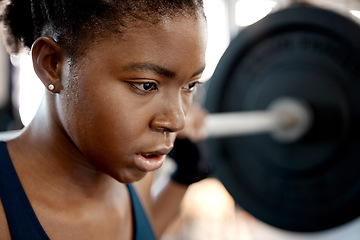 Image showing Closeup, weightlifting and barbell with black woman in gym for workout, strong and muscle. Health, challenge and exercise with female bodybuilder and weights for focus, performance and commitment