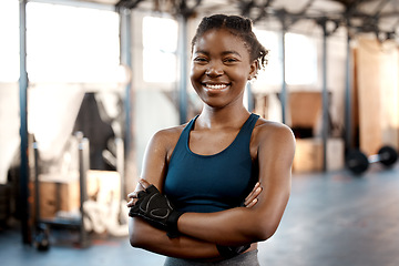 Image showing Happy black woman, portrait smile and fitness with arms crossed for workout, exercise or training at the gym. Fit, active or sporty African female person or athlete smiling for healthy wellness