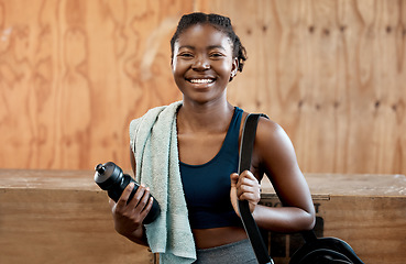 Image showing Happy black woman, portrait and fitness for workout, exercise or cardio training at the gym. Fit, active or sporty African female person or athlete with smile and towel for healthy wellness indoors