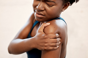 Image showing Fitness, injury and black woman with shoulder pain during exercise at sports studio, massage and relief. Gym, hand on arm muscle for support and African girl with body ache during training or workout