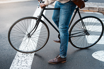 Image showing Bicycle, travel and legs of business man on street for transport, commute and journey to work. City, traffic and male person on bike for eco friendly, carbon neutral and sustainability transportation