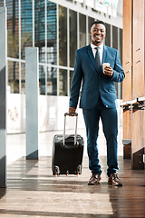 Image showing Travel, business and portrait of black man with suitcase for international conference, global trip and meeting. Corporate, luggage and male entrepreneur with coffee for journey, commute or convention