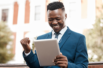 Image showing Happy businessman, tablet and celebration in city for winning, promotion or good news outdoors. Black man with smile on technology for trading, profit or lottery win in success on outdoor park bench