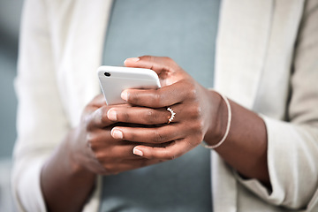 Image showing Phone, hands and closeup of a businesswoman browsing on social media or the internet. Technology, communication and female employee typing or networking on a mobile app with a cellphone in workplace.