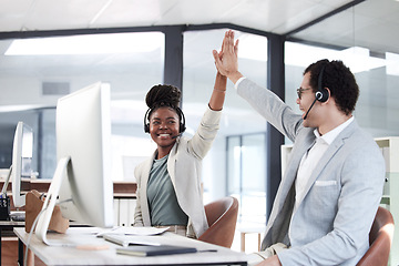 Image showing Business people, call center and high five for success, winning or promotion together at the office. Happy man and woman consultant or agent in celebration for teamwork, sale or win in contact us