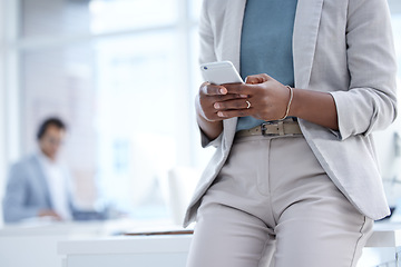 Image showing Phone, office and closeup of a businesswoman networking on social media or the internet. Technology, professional and female employee typing for browsing on a mobile app with a cellphone in workplace