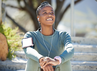 Image showing Smile, fitness and black woman with on steps, music and relax with earphones, exercise and workout goal. Female person, girl and athlete listening to sound, audio and calm outdoor, sports or wellness