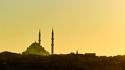 Image showing Silhouette of a Mosque Fatih in a fog and sunlight reflections. Vintage style.