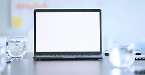 Image showing Laptop screen, mockup and boardroom of a tech company at a desk with digital presentation. Internet, web slides and technology with a computer for business meeting and workshop with sales data