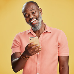 Image showing Black man, studio and smile for phone communication, social media or online announcement. Mobile, mockup and person happy ux with app, reading website or typing post on internet or search on web