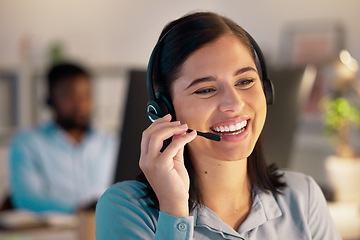 Image showing Call center, smile and business woman in office for customer service, telemarketing or support at night. Contact us, crm and female sales agent, consultant or employee working on consulting deadline.