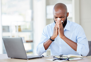 Image showing Black man in office, blowing nose with allergies and sick while at work, professional person with virus and health problem. Businessman at desk with allergy, using tissue with disease and illness