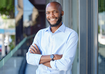 Image showing Confidence, crossed arms and portrait of a businessman in the city by a office building. Success, happy and professional African male financial analyst standing outside his workplace in an urban town