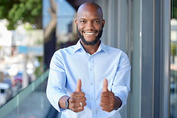 Image showing Thumbs up, thank you and portrait of a black man entrepreneur happy for startup or company success in office building. Agree, yes and young employee or person with agreement sign, gesture and smile