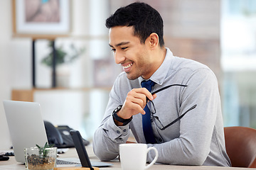 Image showing Happy, businessman and working in office or writing email, communication or research on laptop for corporate job. Man, smile and professional employee planning report or business analytics on company