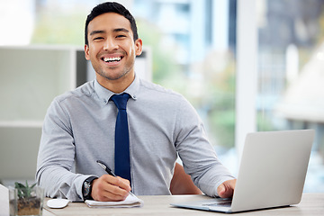 Image showing Portrait, happy businessman and working in office or writing in notebook or research on laptop for corporate job. Man, smile and employee planning with notes, report or business analytics on company