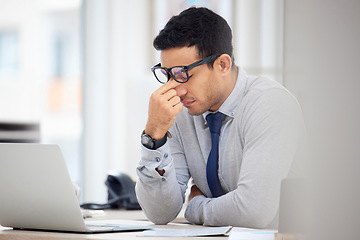 Image showing Stress, headache and business man on laptop for debt review, financial mistake and company crisis or fail. Computer, online taxes and audit employee, accountant or person with depression or problem