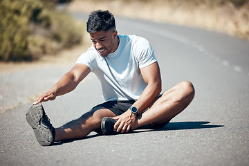 Image showing Happy man, fitness and stretching body on road for running, cardio workout or exercise outdoors. Fit, active or sporty male person, athlete or runner in warm up leg stretch for training on street