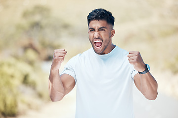 Image showing Man, fitness and fist in nature for celebration, winning or achievement from workout, exercise or training outdoors. Happy and excited male person, athlete or runner in joy for cardio, win or victory