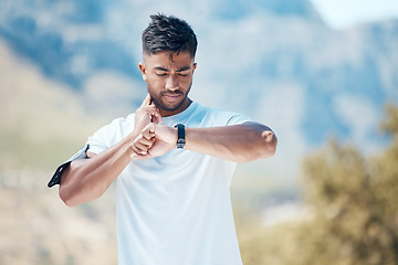 Image showing Health, smartwatch and athlete training heart rate for outdoor sports, marathon or cardio strength with mountain exercise. Fitness, watch and young man or runner on a hike workout for wellness