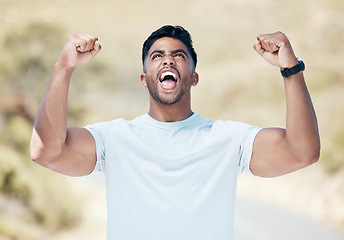 Image showing Man, fitness and fist in celebration for winning, achievement or workout exercise and training in nature outdoors. Happy and excited male person, athlete or runner in joy for cardio, win or victory