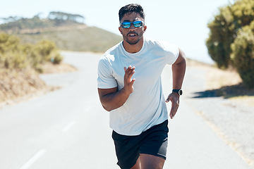 Image showing Man, fitness and running in nature for workout, cardio exercise or training outdoors. Fit, active and sporty male person, athlete or runner exercising on mountain asphalt, road or street outside