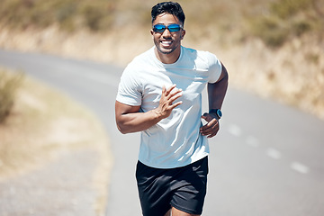 Image showing Happy man, fitness and running on road for workout, cardio exercise or training in nature. Fit, active and sporty male person, athlete or runner exercising on mountain, asphalt or street run outdoors