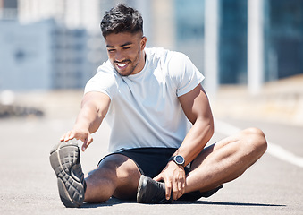 Image showing Happy man, fitness and stretching body in city for running, cardio workout or exercise outdoors. Fit, active or sporty male person, athlete or runner in warm up leg stretch for training in urban town