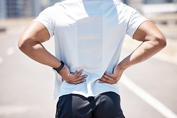 Image showing Back pain, sport injury and person with muscle, inflammation and accident from fitness. Outdoor, athlete and injured joint in spine from workout, exercise and training on road for wellness and health