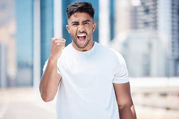 Image showing Happy man, fitness and fist in city for celebration, achievement or winning in the outdoors. Excited male person, athlete or runner in joyful happiness for workout success or exercise in a urban town