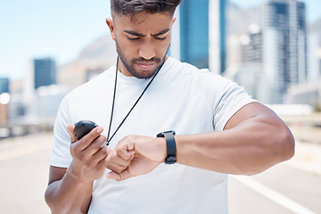 Image showing Fitness, stopwatch and man in city for time, results and tracker for running, exercise and workout. Wellness, sports and male person check smart watch for marathon training, monitor and performance