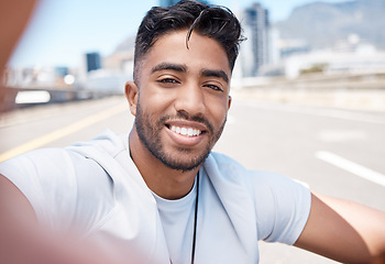 Image showing Happy, selfie and fitness with man in city for social media, profile picture and running. Smile, workout and relax with portrait of male runner and photo in road for exercise, training and freedom