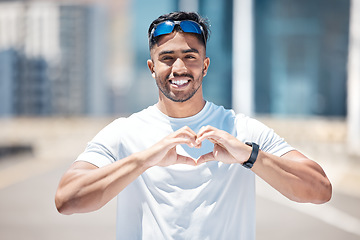 Image showing Happy man in portrait, heart hands and athlete outdoor, sports and fitness with health and wellness. Healthy male person smile in city, self love and care with cardio, exercise with emoji or sign