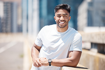 Image showing Fitness, man and portrait in the city with break from running, workout and exercise outdoor. Urban, male person and Indian athlete with happiness, wellness and health from run for race in town