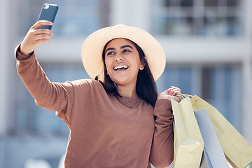 Image showing Shopping, selfie and happy Indian woman in city with smile for online post, social media and internet. Retail, fashion and female person take picture with bags from bargain, sale and discount in town