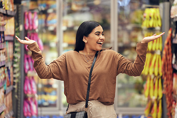 Image showing Excited, grocery and shopping with woman in supermarket for sale, product deal and food. Choice, offer and happy with female customer in groceries store for retail promotion, health and discount