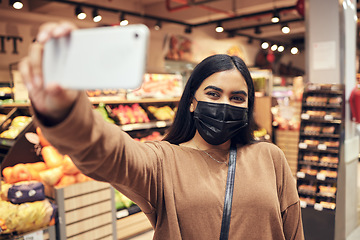 Image showing Selfie, phone and woman with a mask supermarket for social media, internet or web while shopping for food. Grocery, covid and young customer taking picture on a mobile or smartphone in a shop