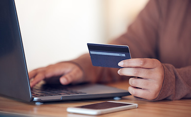 Image showing Online shopping, computer and credit card with freelance worker on a ecommerce website. Person, hands and freelancer at a laptop on a digital store app for deal and discount with payment at table