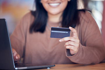 Image showing Online shopping, woman hand and credit card with freelance worker on a ecommerce website. Person, hands and freelancer at a laptop on a digital store app for deal and discount with payment at table