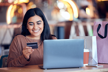 Image showing Online shopping, woman and credit card with freelance worker on a ecommerce website. Person, cafe and freelancer at a laptop on a digital store app for deal and discount with payment at table