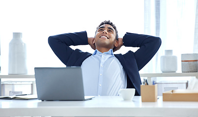 Image showing Relax, business and man with a smile, laptop and good deal in an office, calm and stretching. Male person, consultant and agent in a workplace, rest and peace with sales, connection and finished task