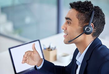 Image showing Happy, call center or telemarketing agent talking in customer service office with laptop and working on computer screen. Hispanic man, businessman and consulting operator on crm and sales support