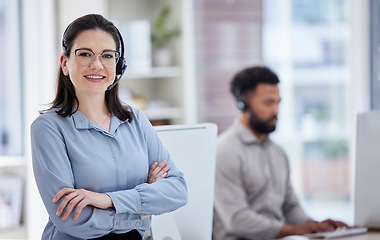 Image showing Call center, customer support and portrait of woman with crossed arms in office for CRM help. Professional, telemarketing and happy female worker with headset for contact, support and consulting