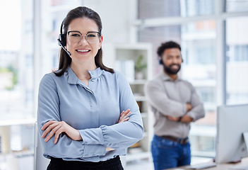 Image showing Crossed arms, customer support and portrait of woman in call center, helping and coworking office. Professional, telemarketing and female worker with headset for contact, crm service and consulting