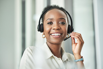 Image showing Black woman face, call center and phone consultation with a smile in a office with contact us work. Telemarketing, portrait and African female employee with communication and customer service